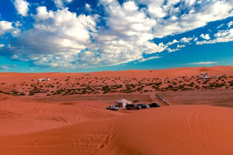 Saudi Arabian desert landscape under a dramatic sky